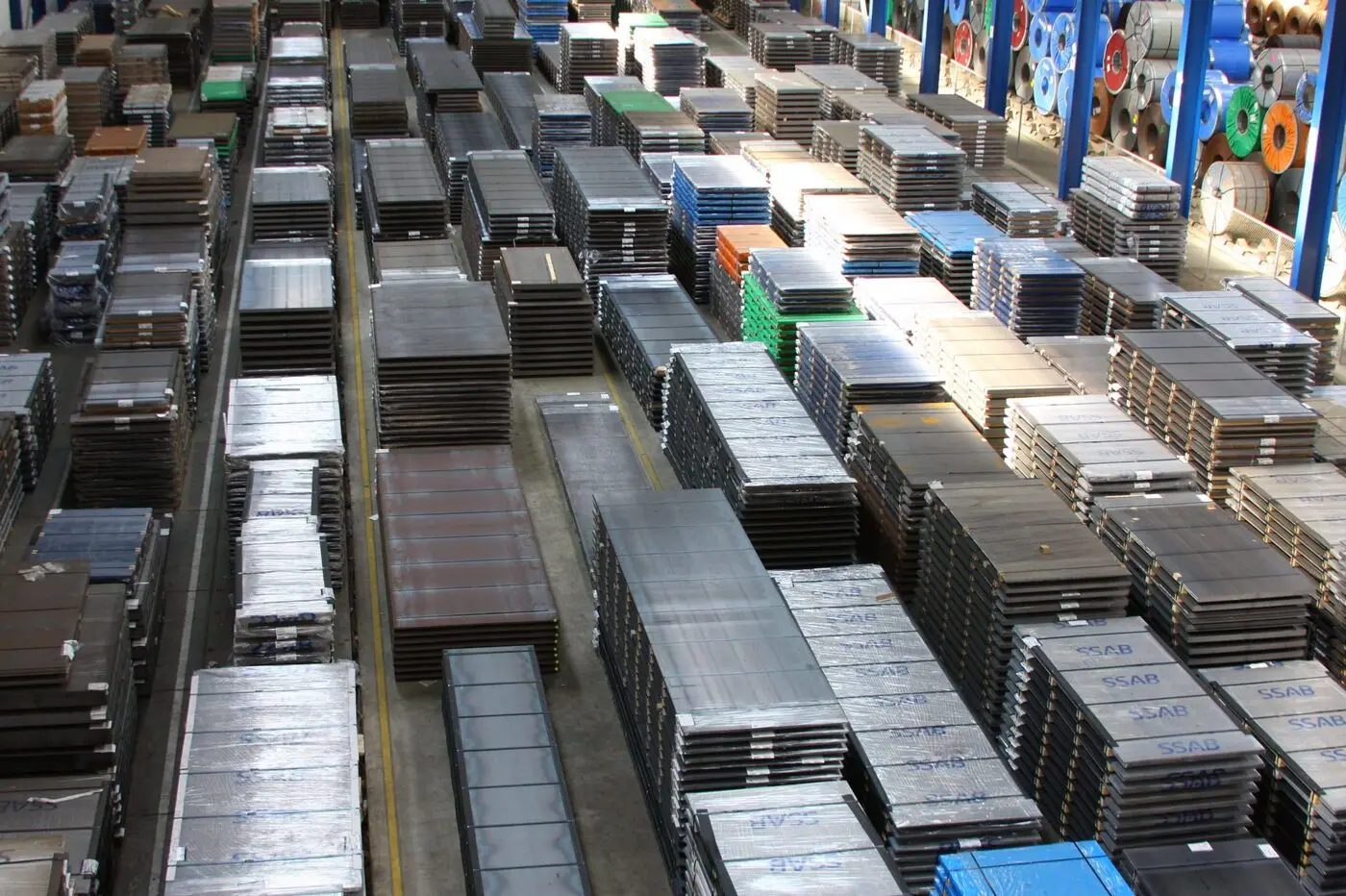 Heavy steel stored under the overhead cranes before onward transport